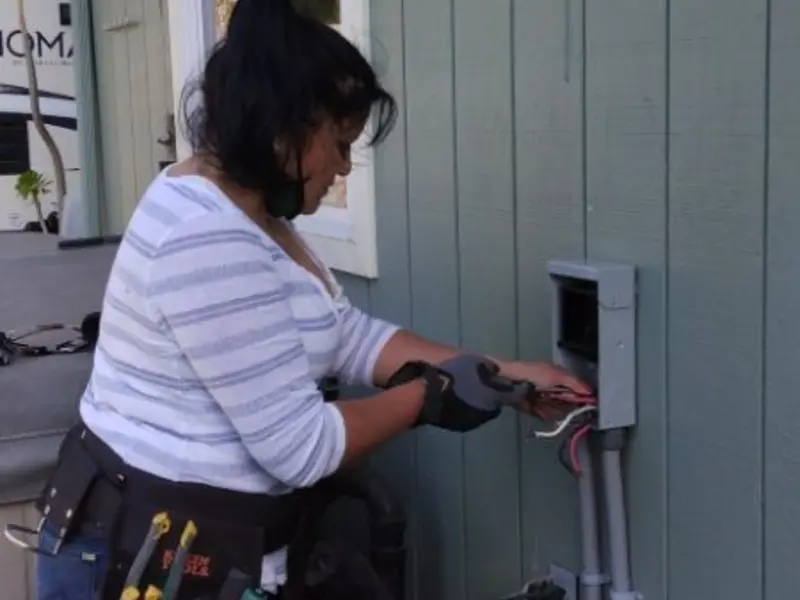 Licensed electrician wiring an exterior subpanel in Woburn